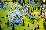 Miniature model - a park with a Ferris wheel and the railway