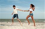loving guy and a girl standing on the beach