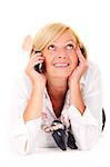 A picture of a mature woman lying and talking on the phone over white background