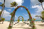 Wedding archway on tropical beach.