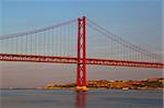The 25 de Abril Bridge is a suspension bridge on river Tejo, Lisboa.
