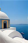 Old church dome and view of mediterranean sea in Thira, Santorini