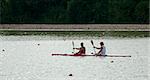 Two rowers in a boat in line