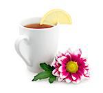Hot tea with lemon and flower isolated on white background