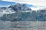 Huge iceberg in Antarctica, blue sky, azure water, sunny day.