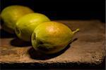 autumn fresh pears over old wood board