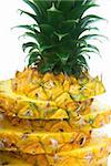 ripe vivid pineapple sliced over white background
