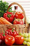 Composition with raw vegetables and wicker basket