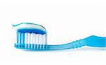 tooth brush and tooth paste on white background