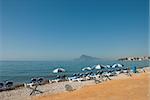 Sunshades and deckchairs on a quiet beach