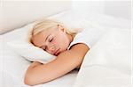 Peaceful woman sleeping in her bedroom