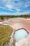 Beautiful colors of the Artist Paint Pots area in Yellowstone National Park - Wyoming.