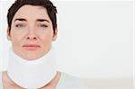 Close up of a sad Woman with a surgical collar in a waiting room