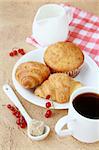 breakfast with fresh coffee, fresh croissants and fruits