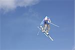 flying skier on mountains, in the sky