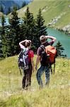 Male and female hikers in the German Alps near Oberstdorf searching the right trail.