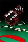 Two dice over a craps table with selective focus