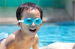 happy asian kid in swimming pool