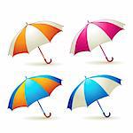 Colored umbrellas over white background