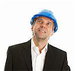 Portrait of successful architect wearing blue hard hat and looking up. Isolated on white