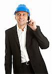 Portrait of architect wearing blue hard hat and talking on mobile phone. Isolated on white