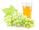 Juicy grape with leaf and full glass of juice on white background