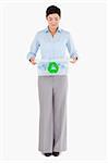 Businesswoman with a recycling box against a white background