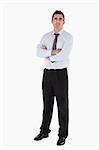 Businessman standing up with his arms crossed against a white background