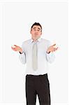 Portrait of a clueless businessman posing against a white background