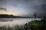 Foggy morning  at a lake in rural Sweden