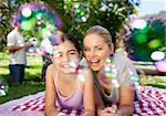 Mother and daughter having fun in the park