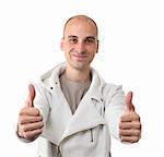 young man showing thumb up and smiling isolated on white background