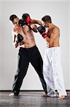 An image of two men box fighting