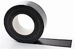 black adhesive tape  on light background. partly unrolled