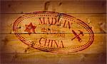 Made in China rubber stamp on wooden background.