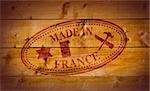 Made in France rubber stamp on wooden background.