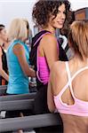 Group of young woman in the gym centre; working out.