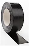 black adhesive tape  on light background. partly unroled