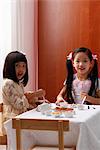 two little girls having a tea party