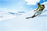 Man skiing in mountain scenery