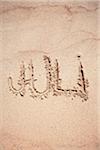 Text Juli written on sand