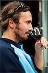 Mid adult man drinking red wine