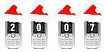 Four cellular mobile phones with a red christmas hat on a white background