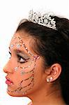 Teenage girl wearing a tiara and makeup made of rhinestone flowers