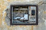 broken switch board, no electricity, rust, old construction