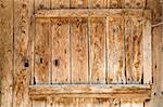 Detail of an ancient rustic wooden door