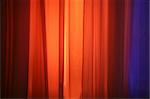 Spot Lights Against Curtain Red and Blue Background Design