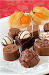 Chocolate candies on white plate, Valentine detail