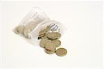 twenty pounds per pound from coin bag on white background