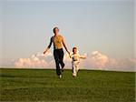 running mother with son